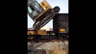 Unloading excavator from rail car [upl. by Azenav]