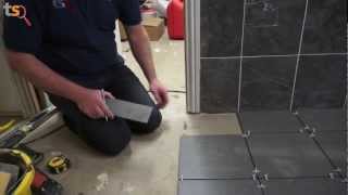 Tommys Trade Secrets  How To Tile A Floor [upl. by Ahsuoj37]