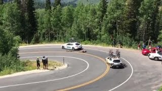 Cyclist racing downhill crashes into moving car [upl. by Enixam850]